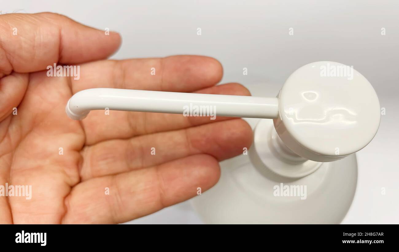 hand cleaning with disinfectant and liquid soap for hygiene Stock Photo