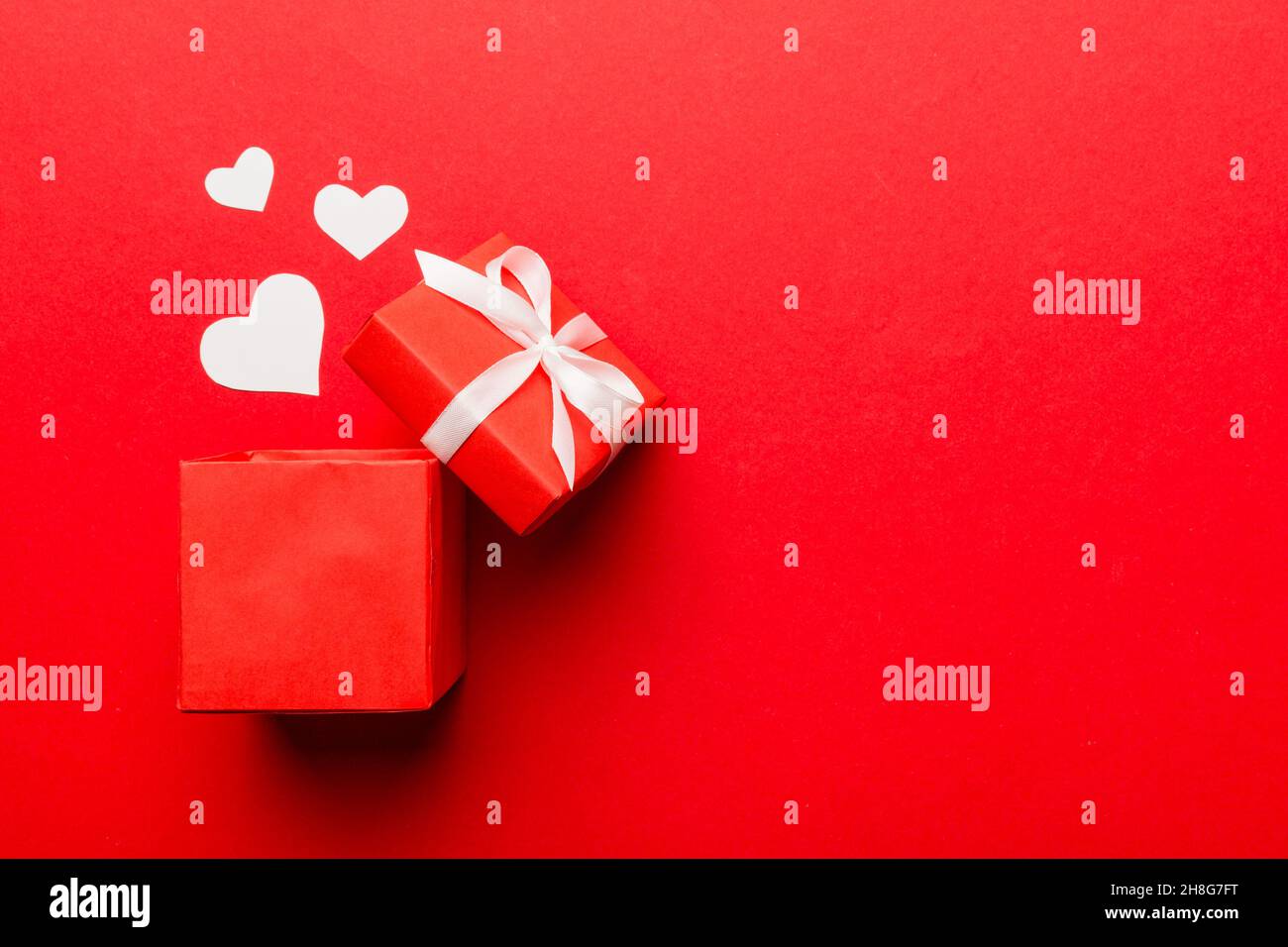 Happy valentines day opened heart shape gift box with small hearts, on ...