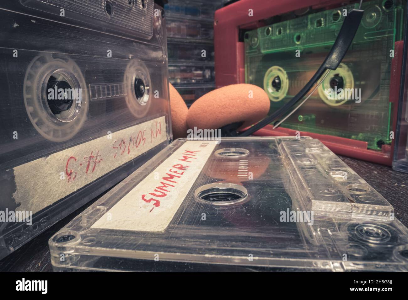 Closeup of old cassette and player. Tapes and player with spinning