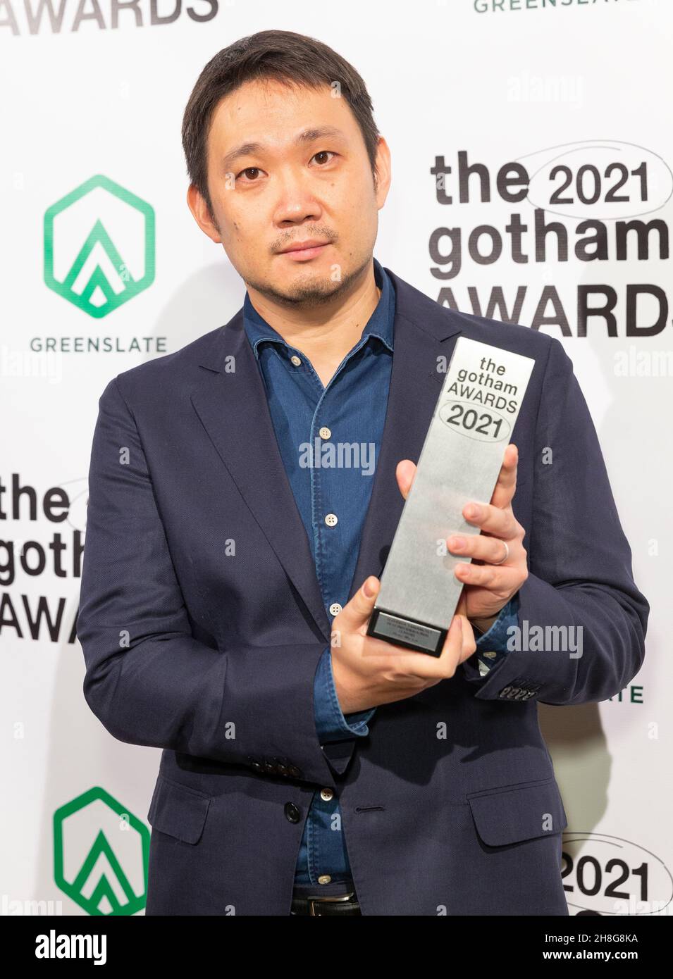 New York, NY - November 29, 2021: Ryusuke Hamaguchi poses in Green Room as winner for best international feature Drive My Car at Cipriani Wall Street Stock Photo