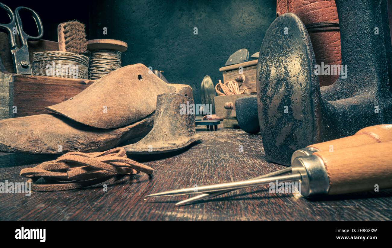 Old shoemaker workshop with tools, strap, leather and rules. Old ...