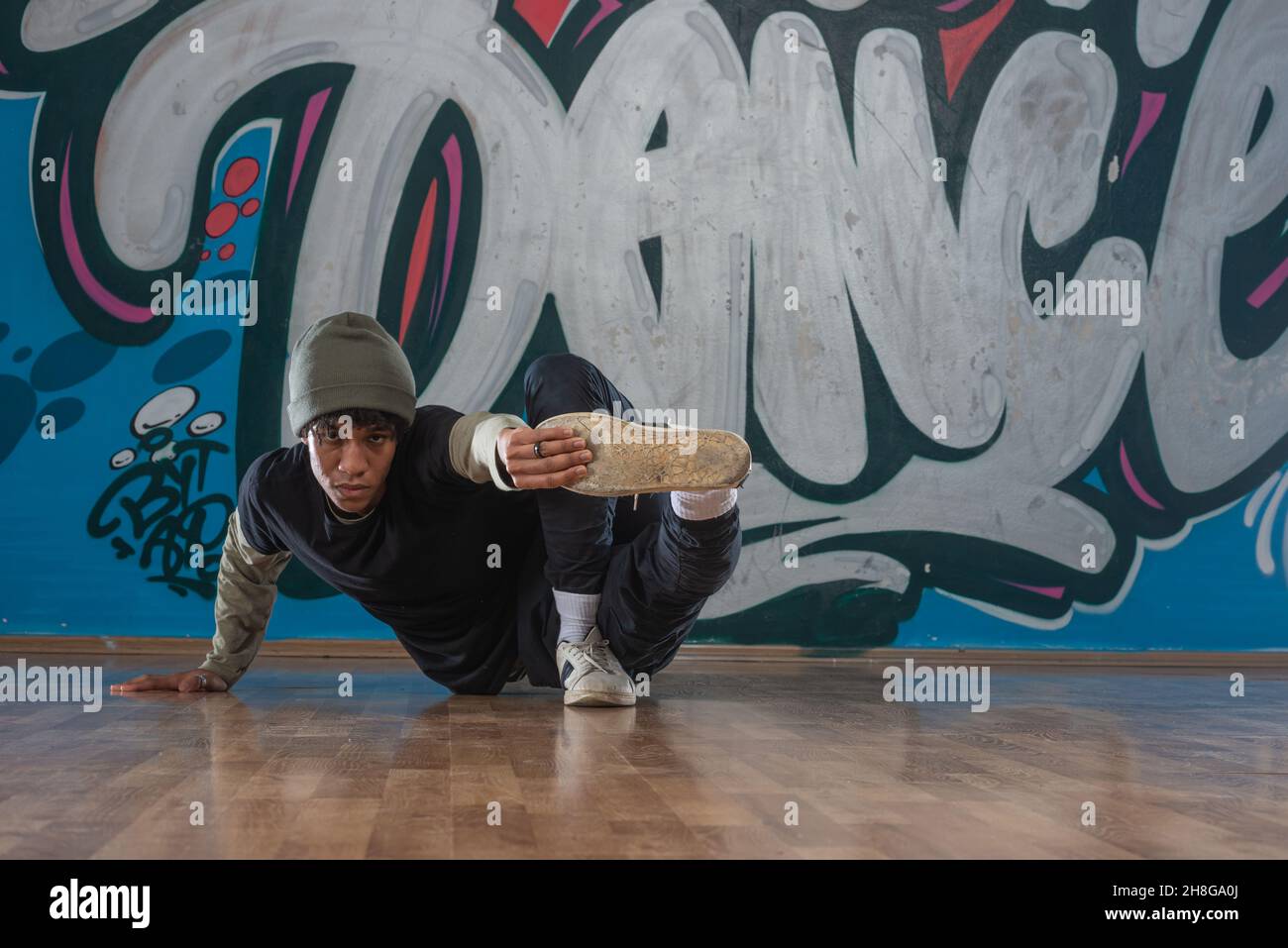 English Rapper Dancing Modern rapper dancing in garage. Urban lifestyle, hip hop Stock Photo ...