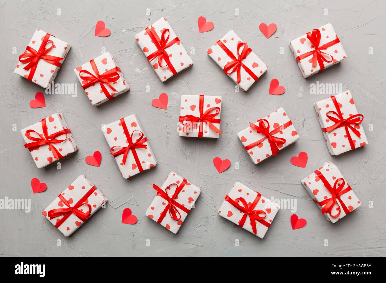 Valentine day composition Background: red gift box with bow and heart ...