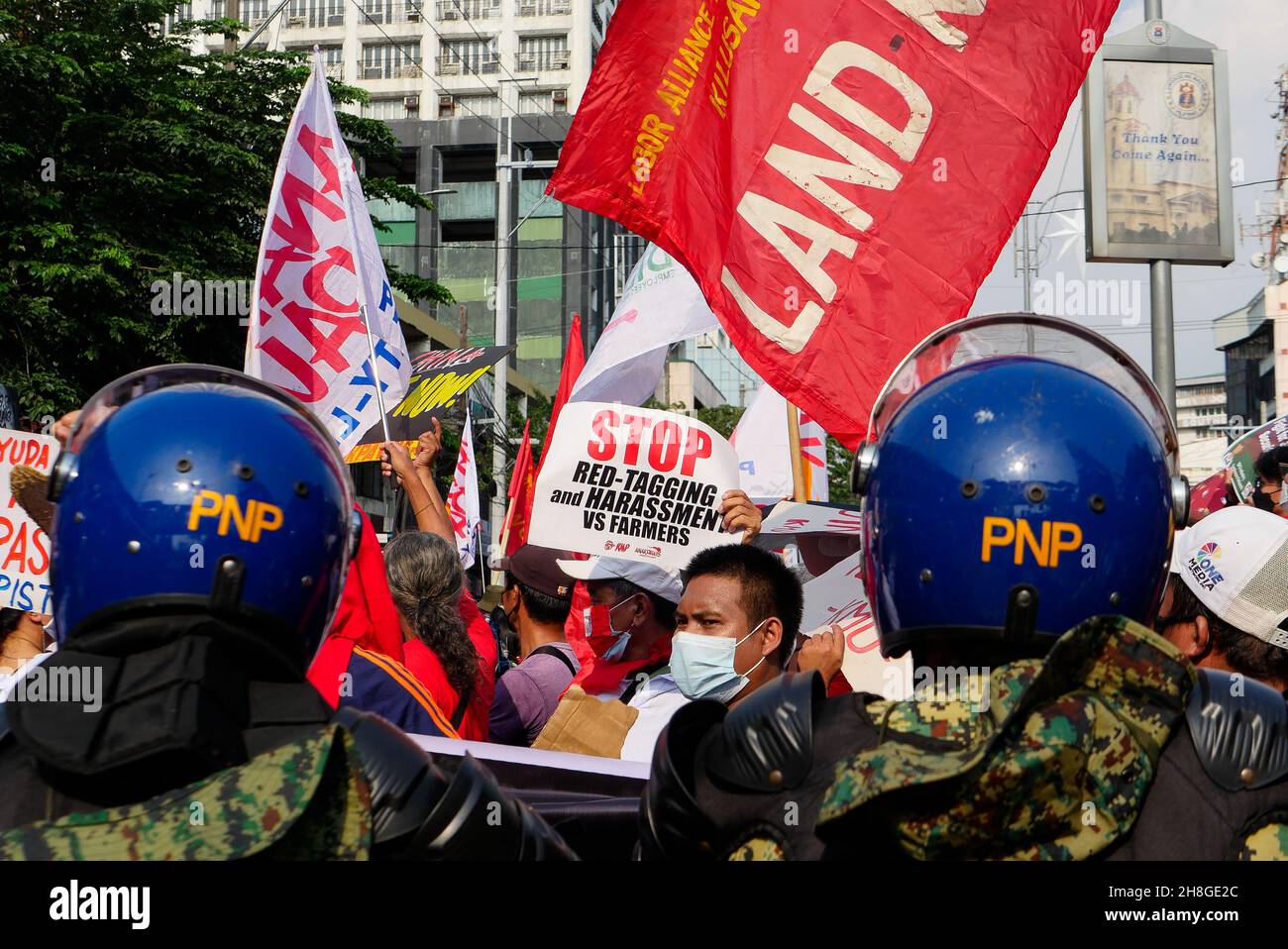 November 30, 2021, Manila City, National Capital Region, Philippines: Several labor workers gathered in groups at Welcome Rotonda at EspaÃÂ±a blvd. The labor workers will march in protest in honor of Andres Bonifacio, a national hero and father of the Philippine revolution. It is in this Andres Bonifacio Day that they'll march towards Mendiola but blocked by the police. The protest march is held to highlight key issues for a safe work place, stop red-tagging poor sector groups, their rights as workers, and freedom from the Duterte's corrupt administration. (Credit Image: © George Buid/ZUMA Pr Stock Photo