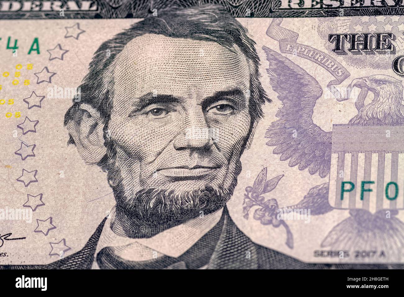 Close-up of 5 us dollar bill. Portrait of President Abraham Lincoln on the five us dollars banknote. Stock Photo