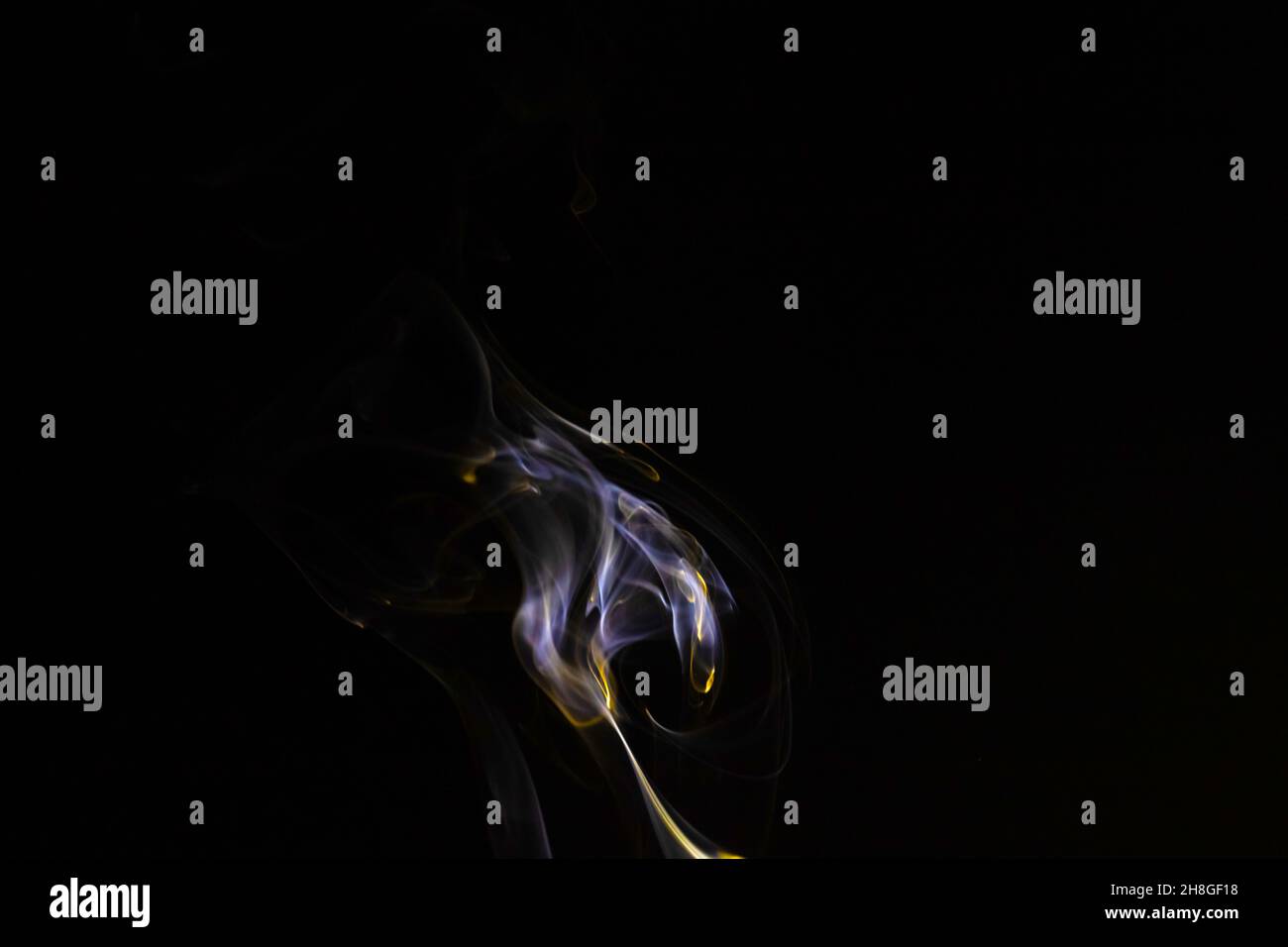 Colored smoke on a black background, abstract backdrop Stock Photo