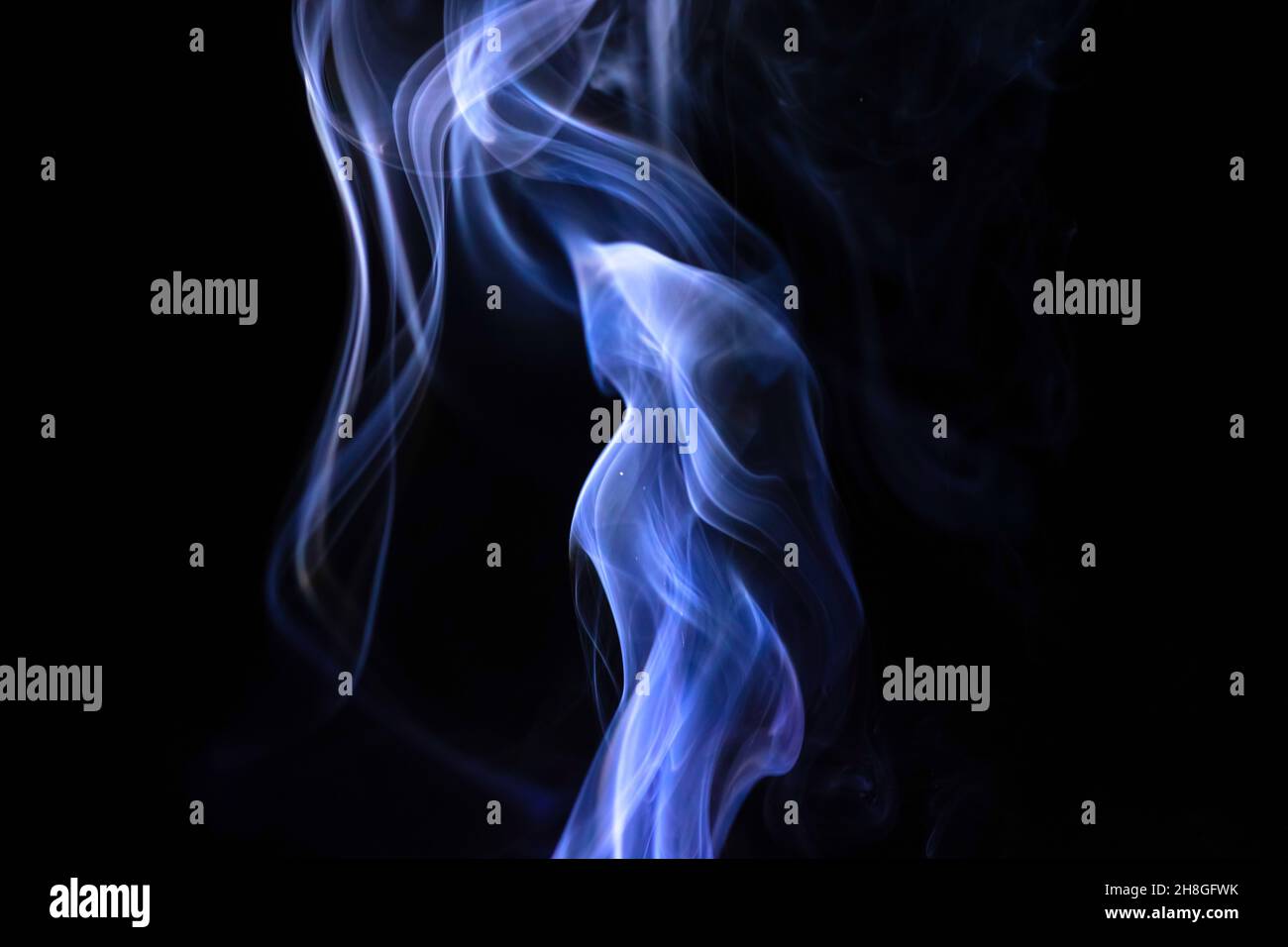 Abstract blue smoke on a black background Stock Photo