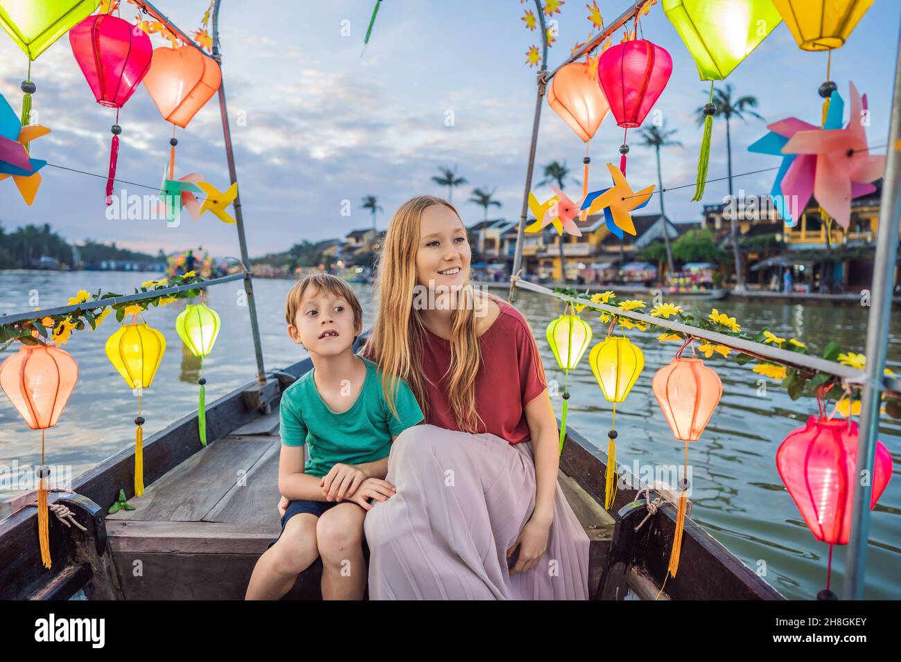 Happy family Mother and son of travelers ride a national boat on ...