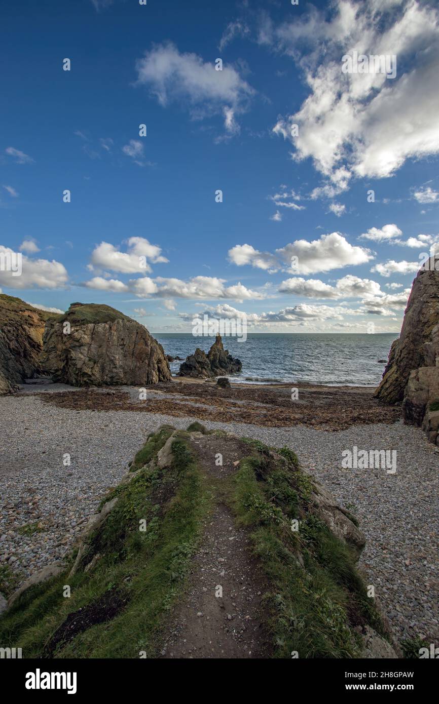 The Peninsula of Howth Head in sunny and cloudy day, hidden bay