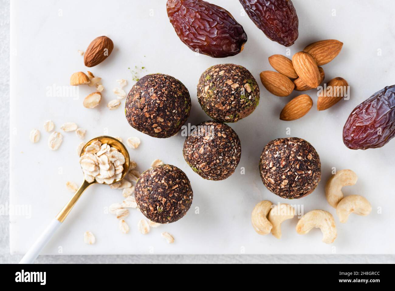 Homemade vegan raw truffles, energy balls with dates, nuts and oats