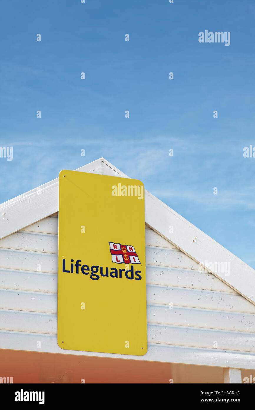 Yellow lifeguards sign with copy space. Stock Photo