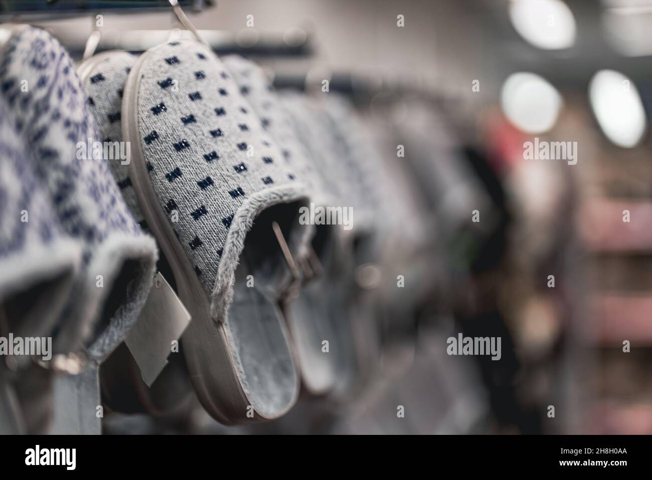 Home slippers in a clothing store. Stock Photo