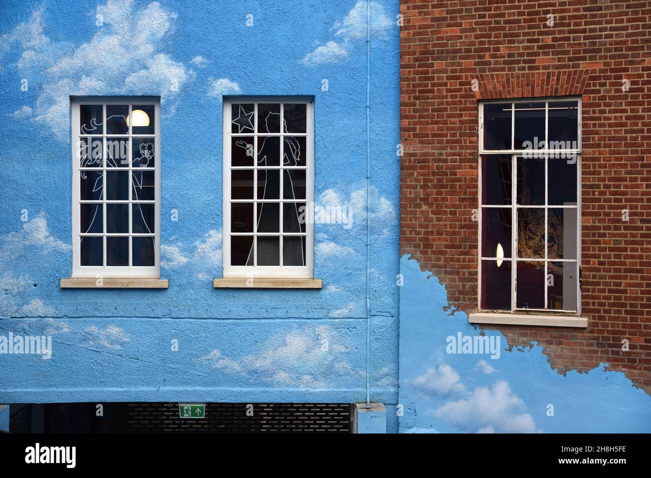 Window Pattern on Blue Wall with Cloud Design on Facade of Old Building The Story Museum in the Old Town or Historic District Oxford England Stock Photo