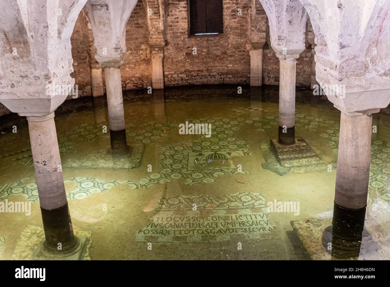 Ravenna, Italy - 01.11.2021 - Submerged crypt of the Basilica of San Francesco - Saint Francis where the goldfish swim over ancient mosaics  - Ravenna Stock Photo