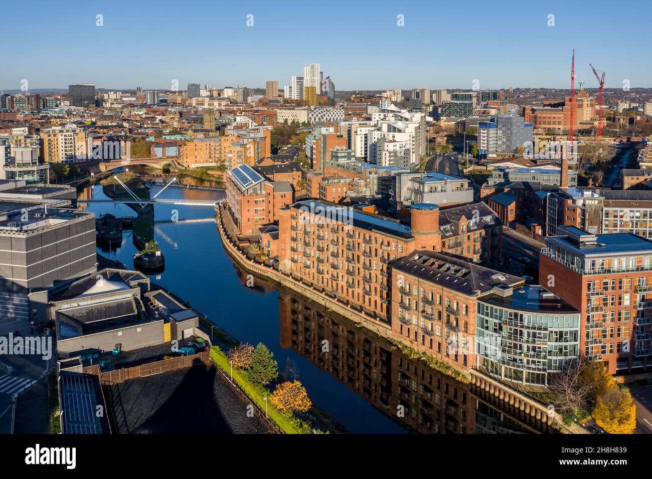 An aerial panorama cityscape of Leeds city centre skyline with luxury waterfront properties at Robert's Wharf Stock Photo