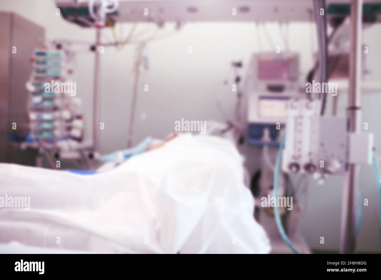Patient in the intensive care unit under 24-hour medical supervision, unfocused background. Stock Photo