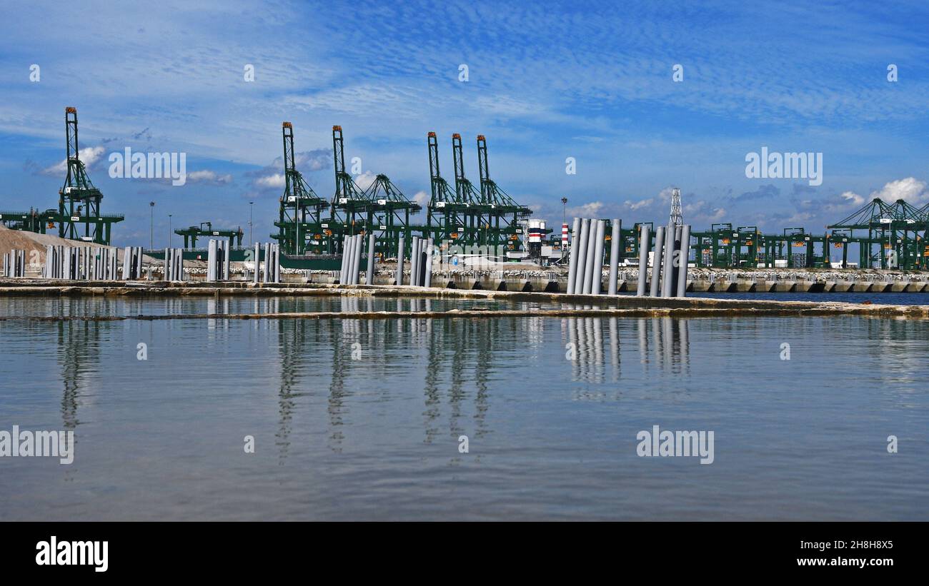 Singapore. 30th Nov, 2021. Photo taken on Nov. 30, 2021 shows Tuas Port under construction in Singapore. The first stage of land reclamation at Tuas Port in Singapore has been completed. Credit: Then Chih Wey/Xinhua/Alamy Live News Stock Photo