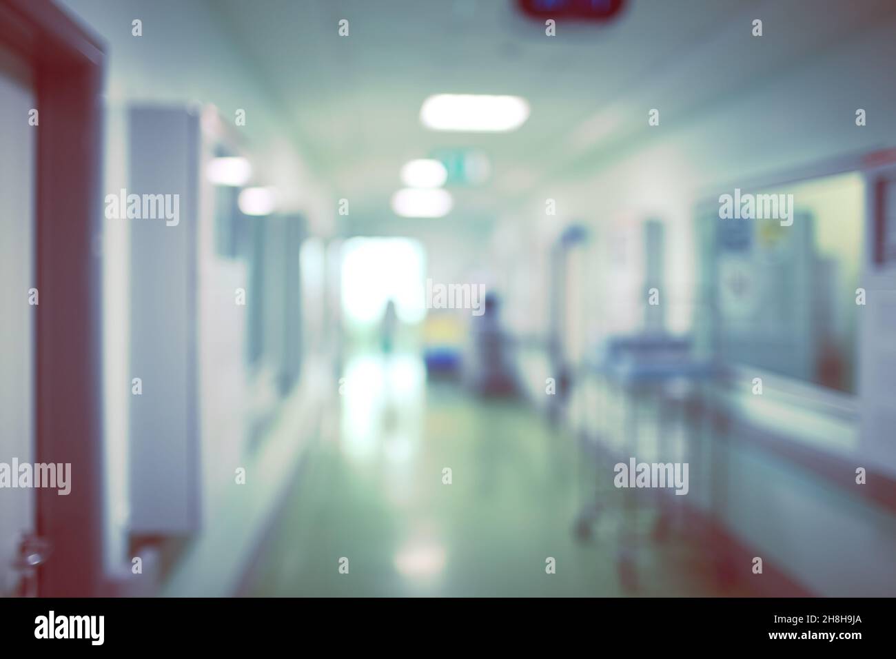 Hospital department with figure coming in, unfocused background. Stock Photo