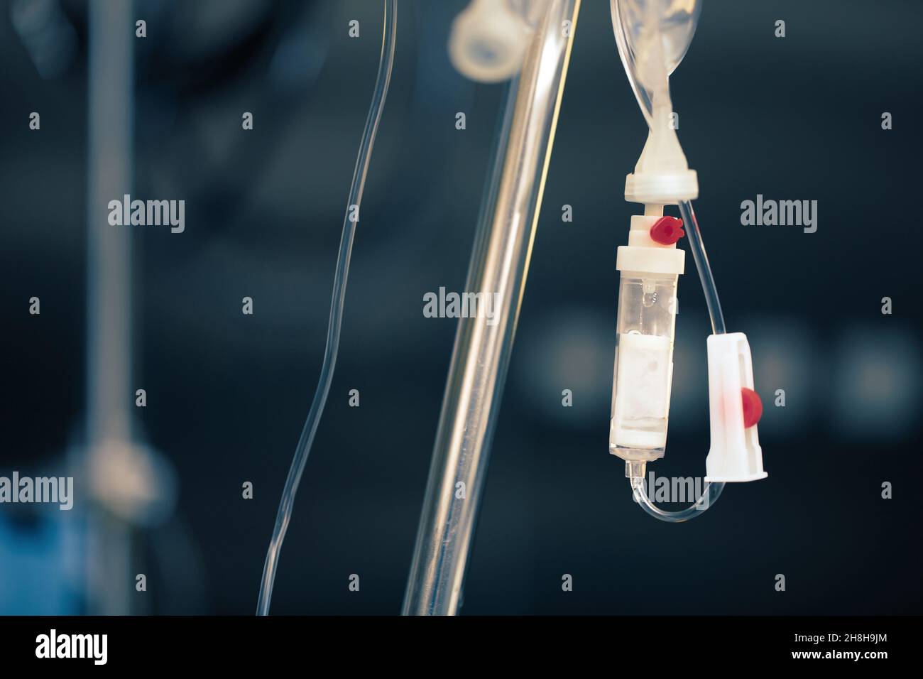 Part of a medical drip in the hospital room. Stock Photo