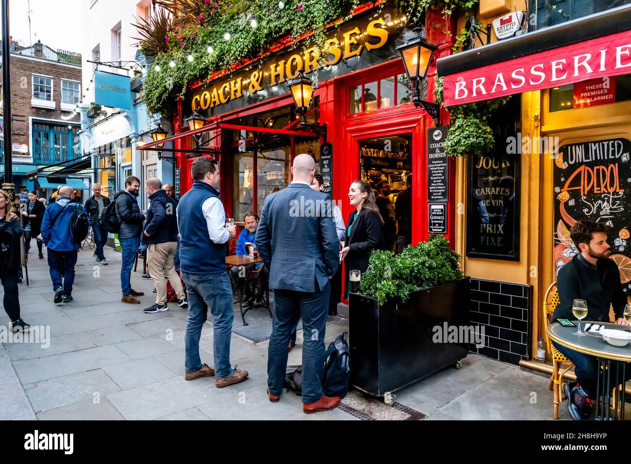 Customers Outside The Coach and Horses Pub In Wellington Street, Covent Garden, London, UK. Stock Photo