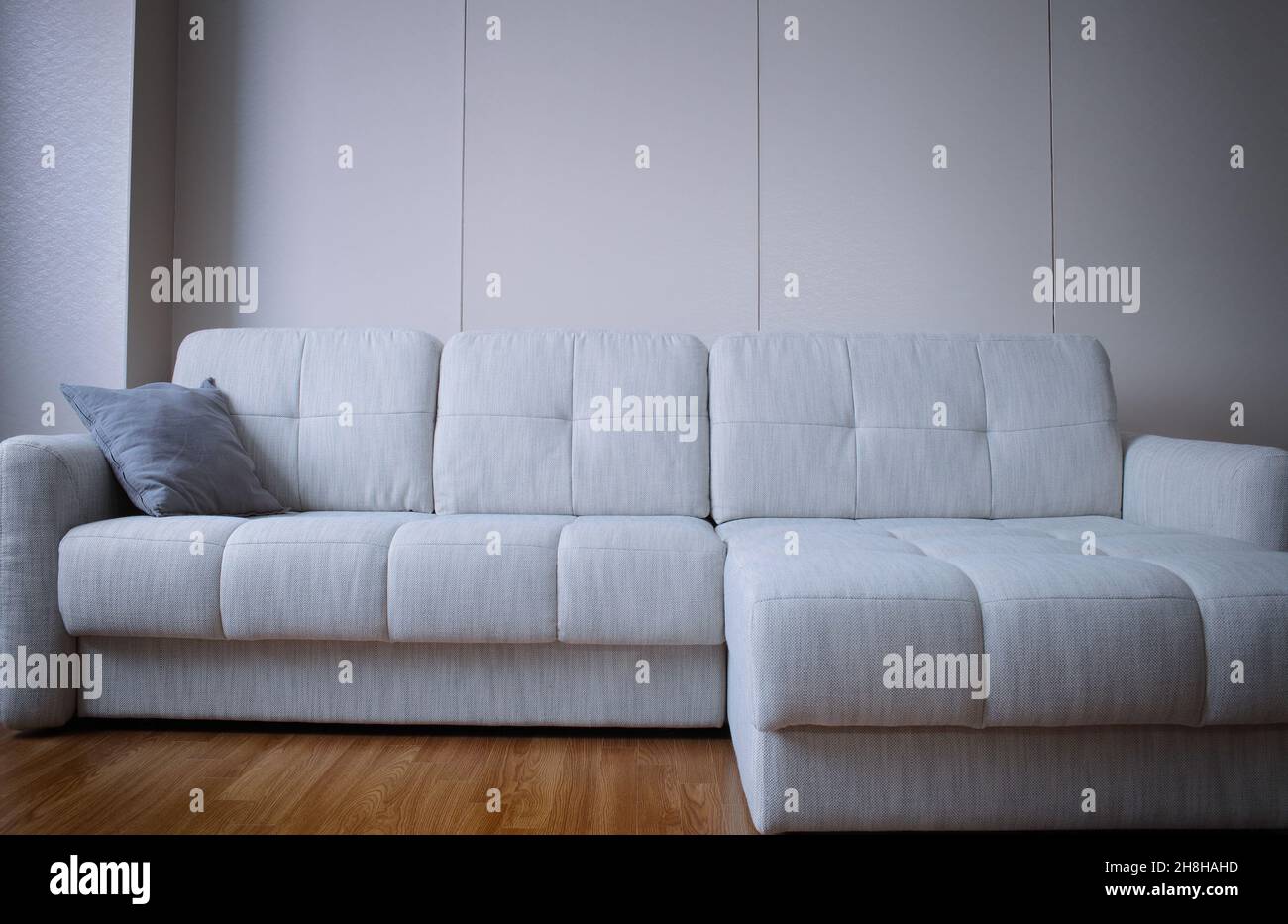 Apartment with a big couch in the modern style Stock Photo Alamy