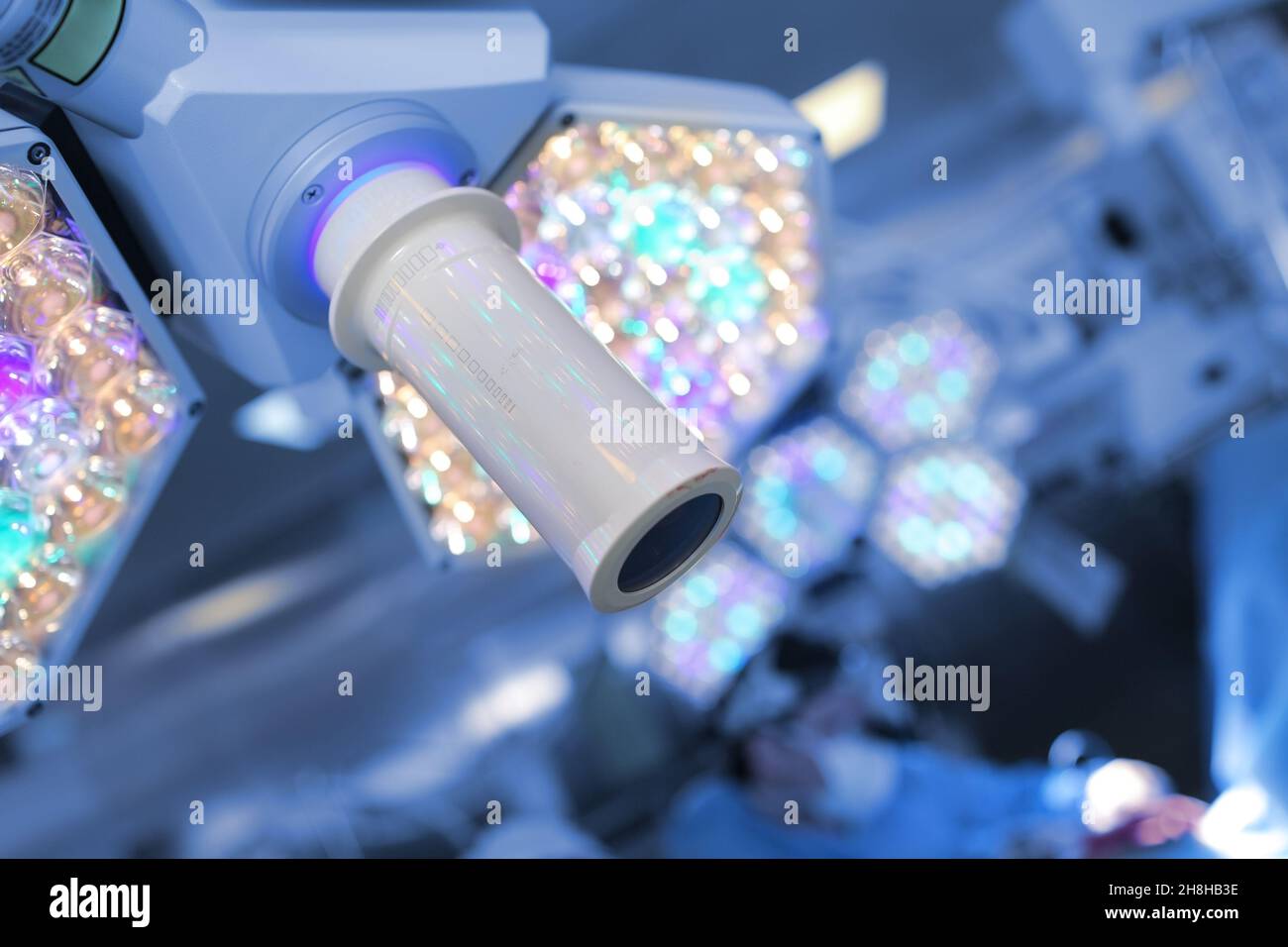 Surgical light on the background of working surgeon in the operating theatre. Stock Photo