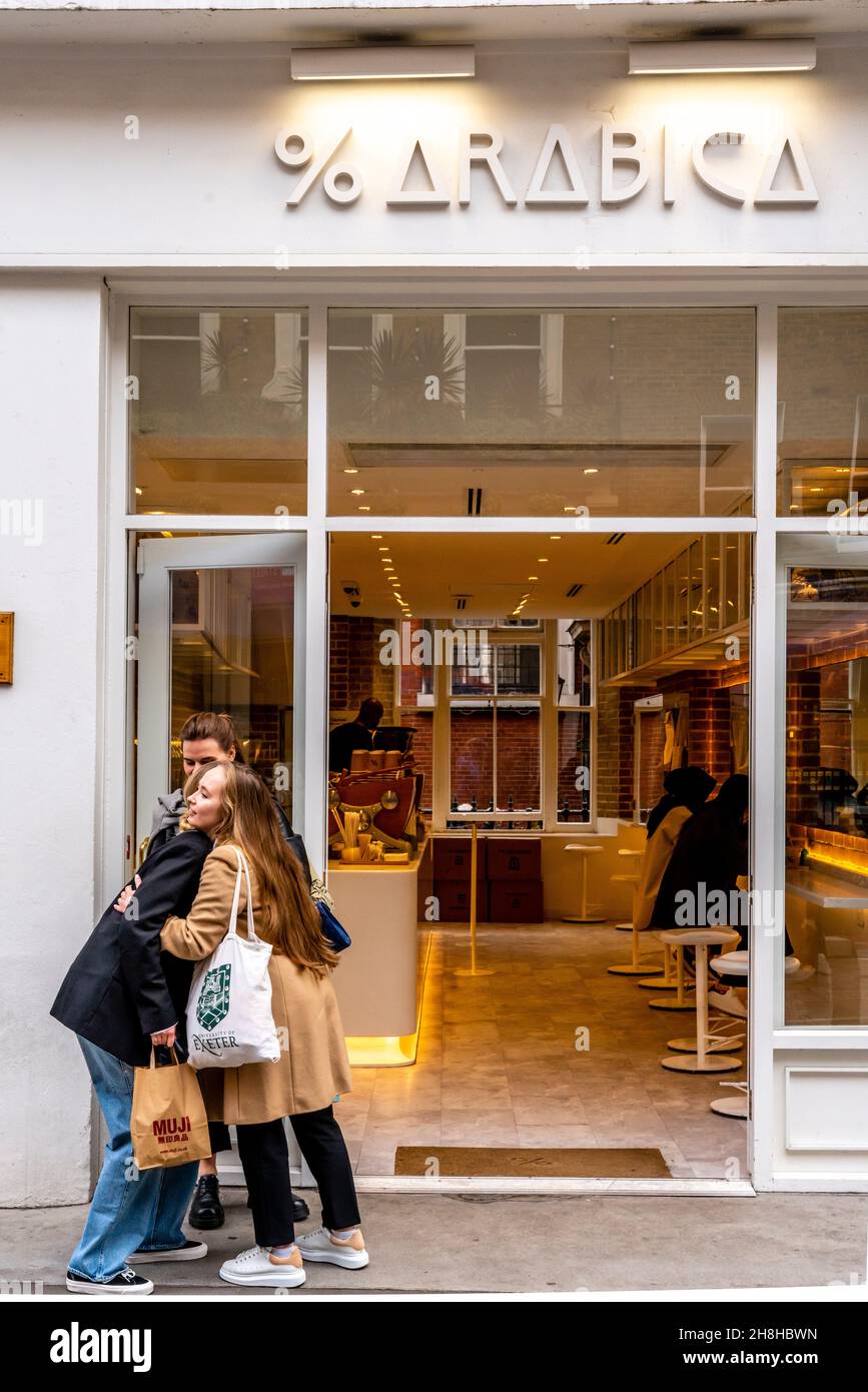 Young Women Meeting Outside The Arabica Coffee Store, King Street