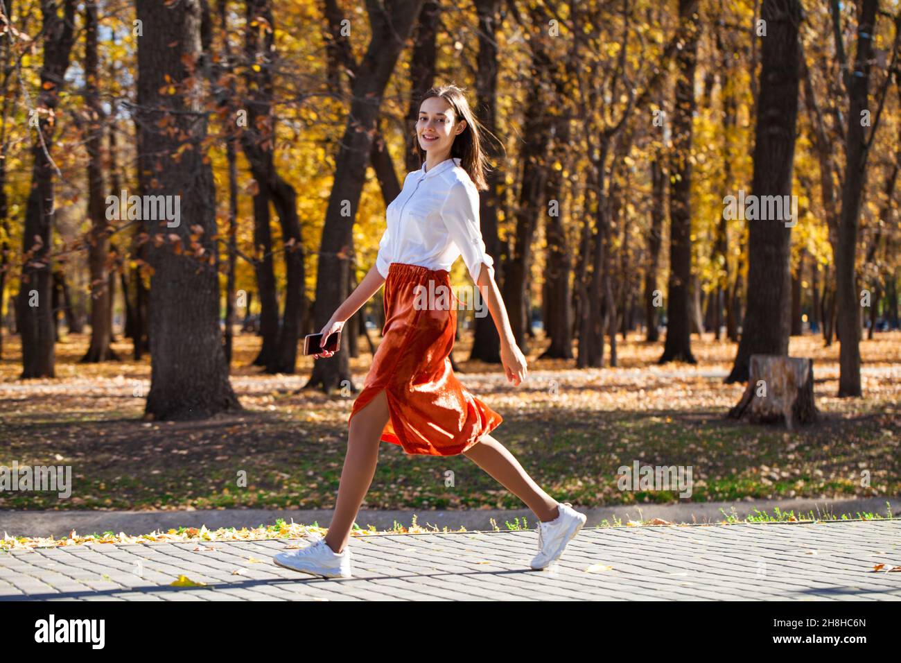 Girl walking legs skirt hi-res stock photography and images - Alamy