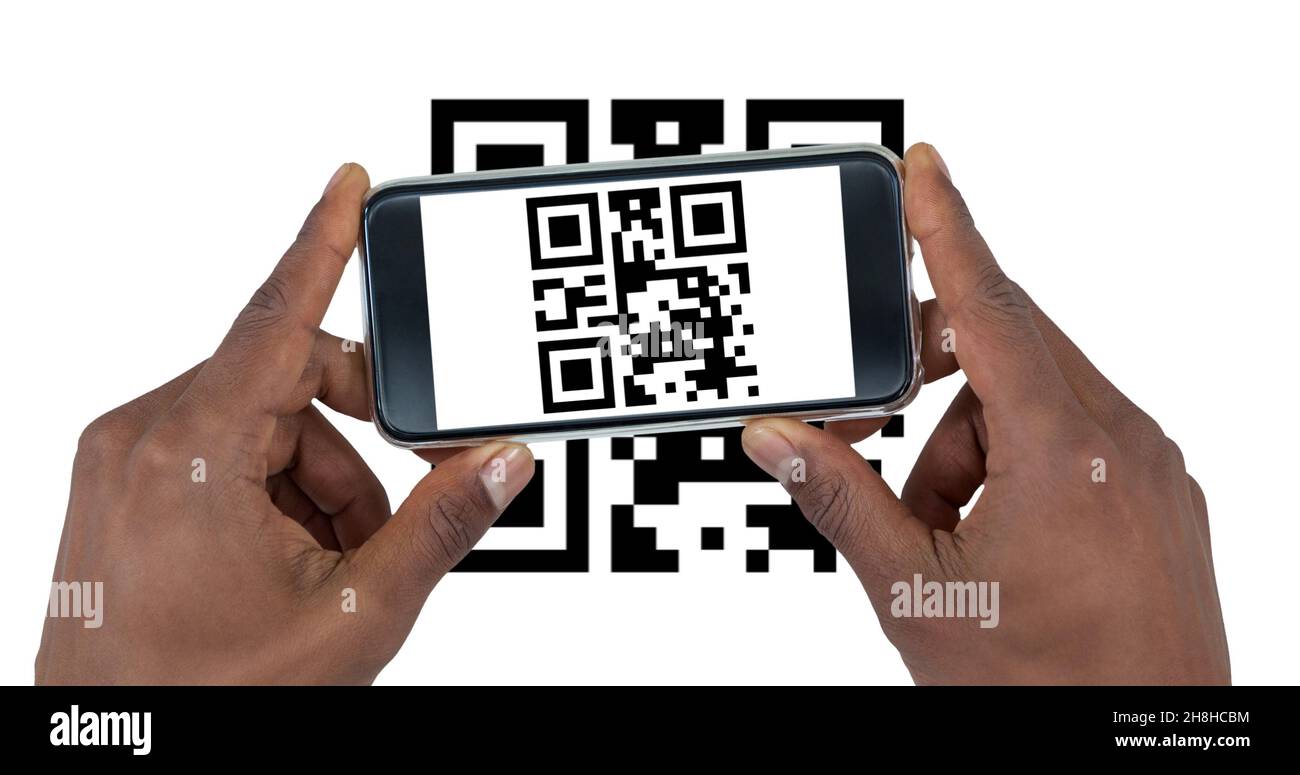 Cropped hand of man scanning qr code with smart phone with copy space on white background Stock Photo