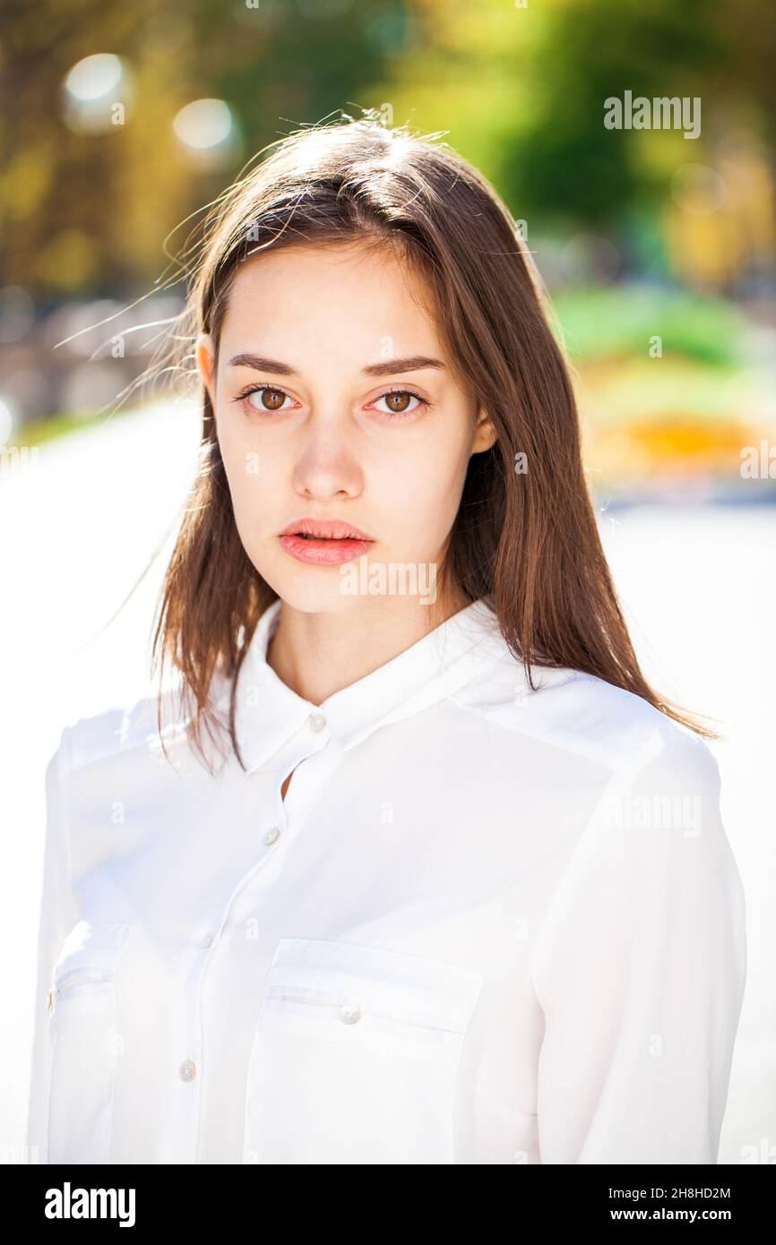 Close up portrait of a young beautiful girl in white shirt Stock Photo ...