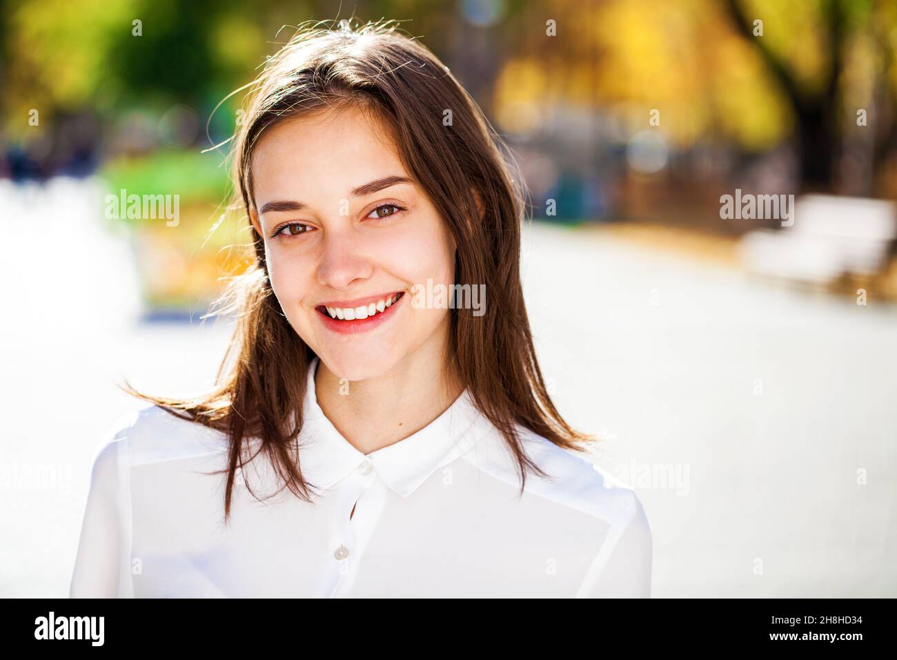 Close up portrait of a young beautiful girl in white shirt Stock Photo ...