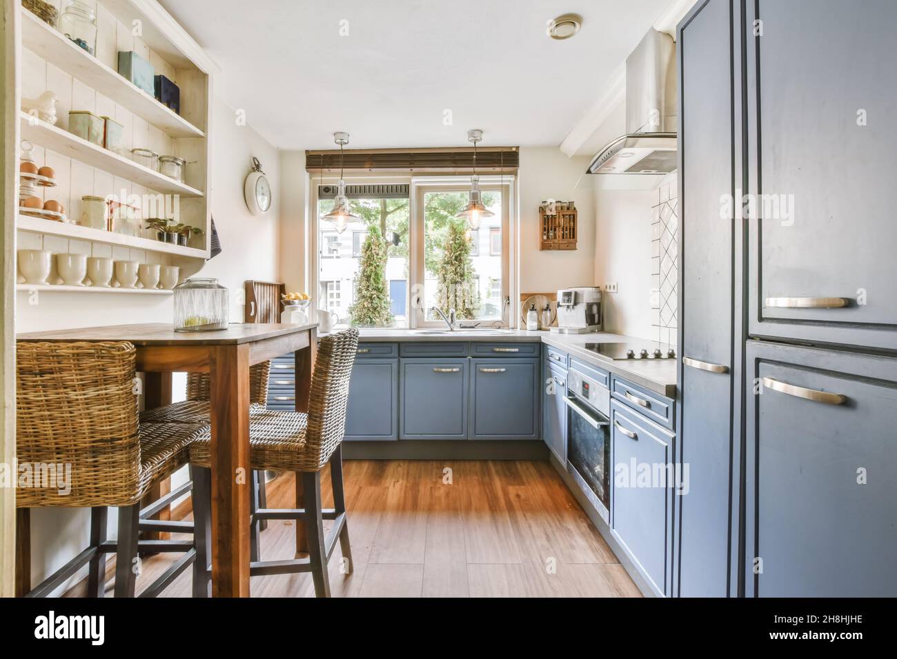 Small pretty kitchen design with a window to the outside Stock Photo ...