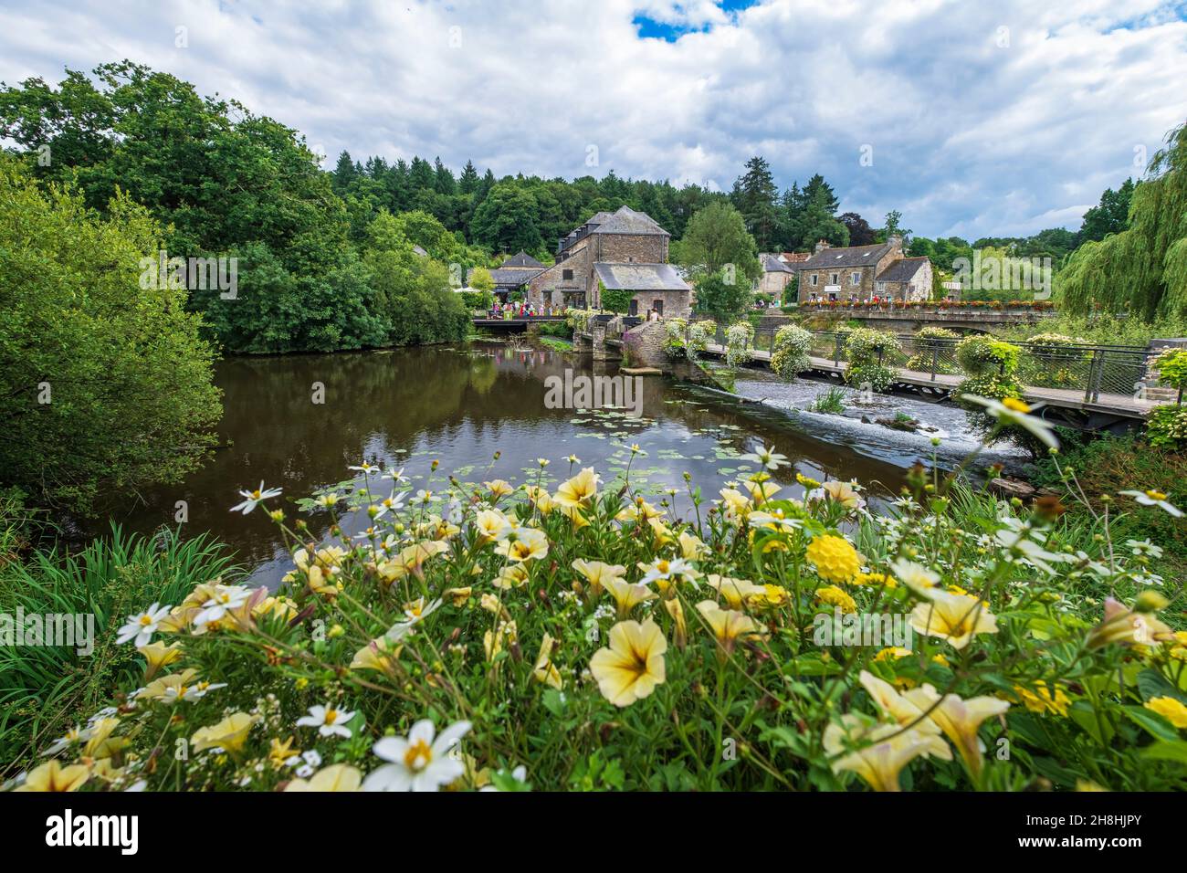 France, Morbihan, La Gacilly, footbridge over the Aff river and Yves Rocher House Stock Photo