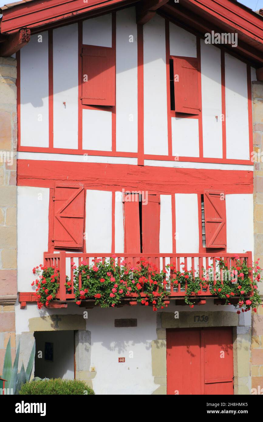 France, Pyrenees Atlantiques, Basque Country, Ainhoa (labeled The most beautiful villages of France), main street, Labourdine house (18th century) with a facade having visible timber frames Stock Photo