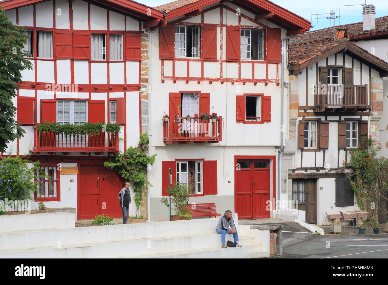 France, Pyrenees Atlantiques, Basque Country, Ainhoa (labeled The most beautiful villages of France), main street, Labourdine houses (18th century) with facades with visible timber framing Stock Photo