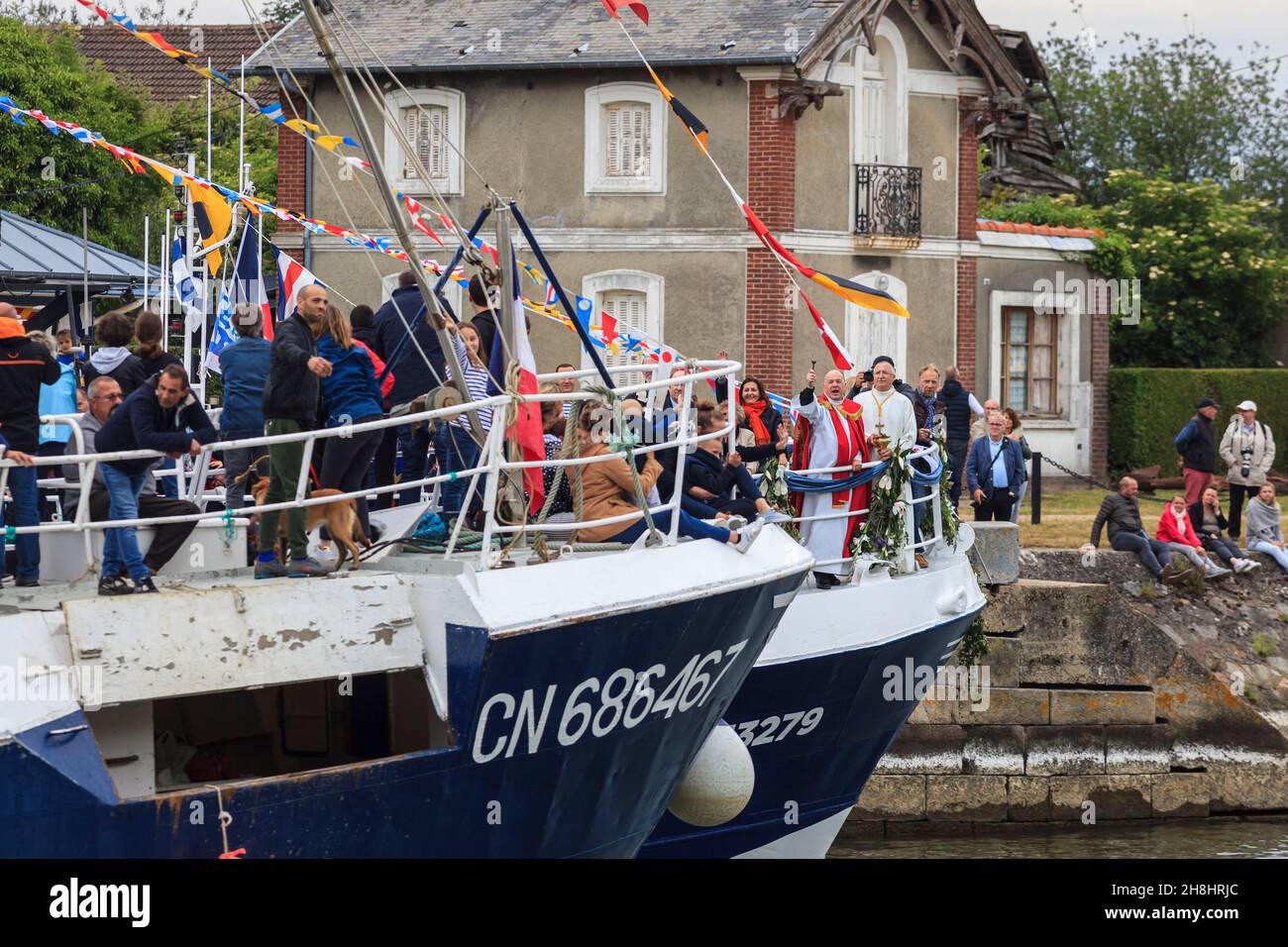 France, Calvados (14), Pays d'Auge, Honfleur, mayor Michelle Lamare and Father Pascal Marie bless the fishermen, from a trawler, at the Sailors Festival which takes place every year at Pentecost Stock Photo