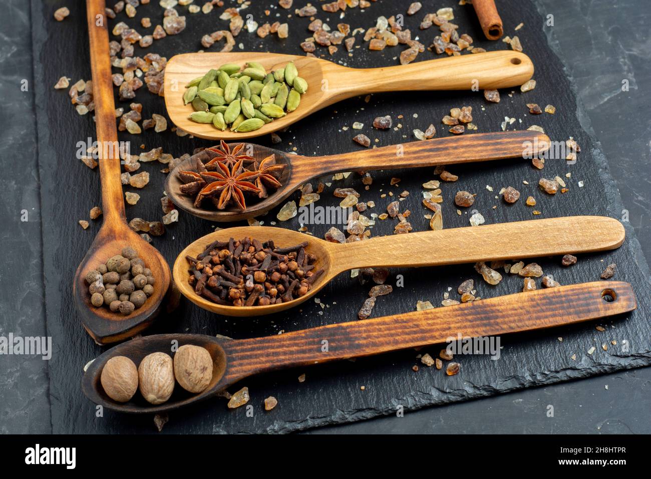 Spices selection over dark wooden table. Food or spicy cooking concept, Healthy eating Background Stock Photo