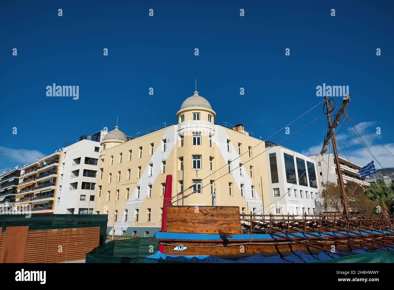 the University building and the mythical ship Argo in the port of Volos, Greece Stock Photo