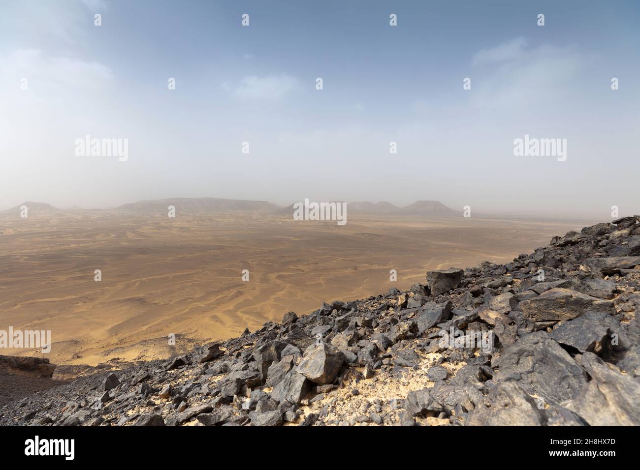 Landscape of the Black Desert with rocks on the background. Stock Photo