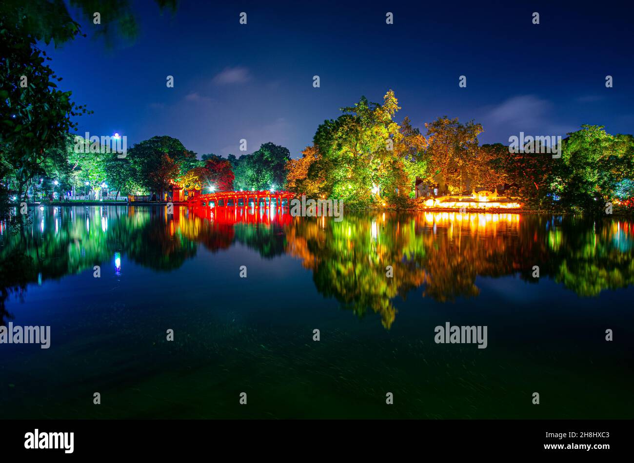 Ngoc Son Temple in Hanoi, Vietnam, at night, all lit up with reflections on the lake Stock Photo