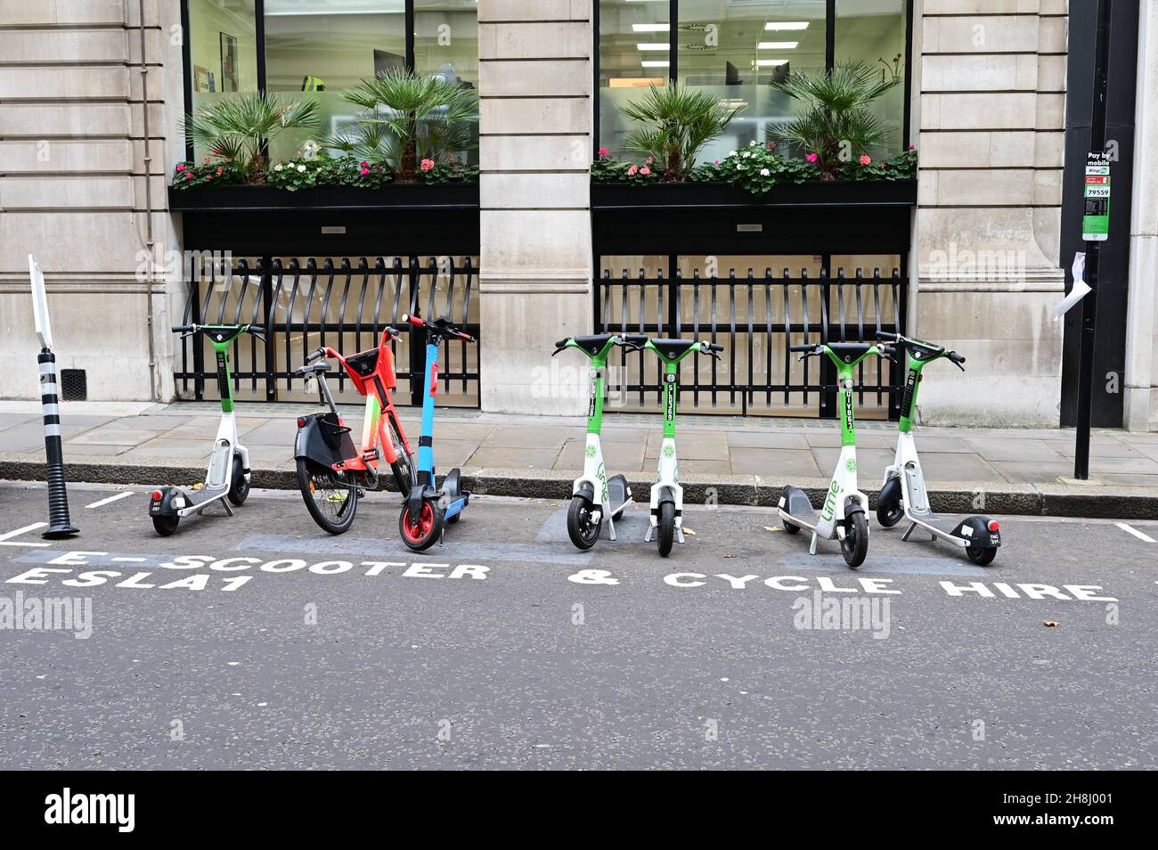 Electric scooter and cycle hire in London Stock Photo Alamy