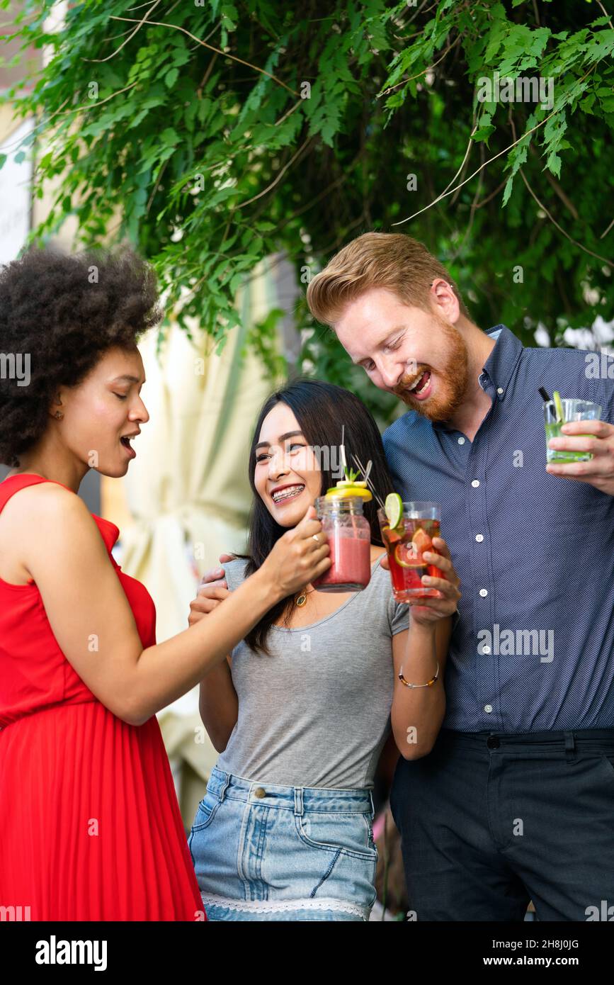 Group of friends having fun together. People talking laughing and ...