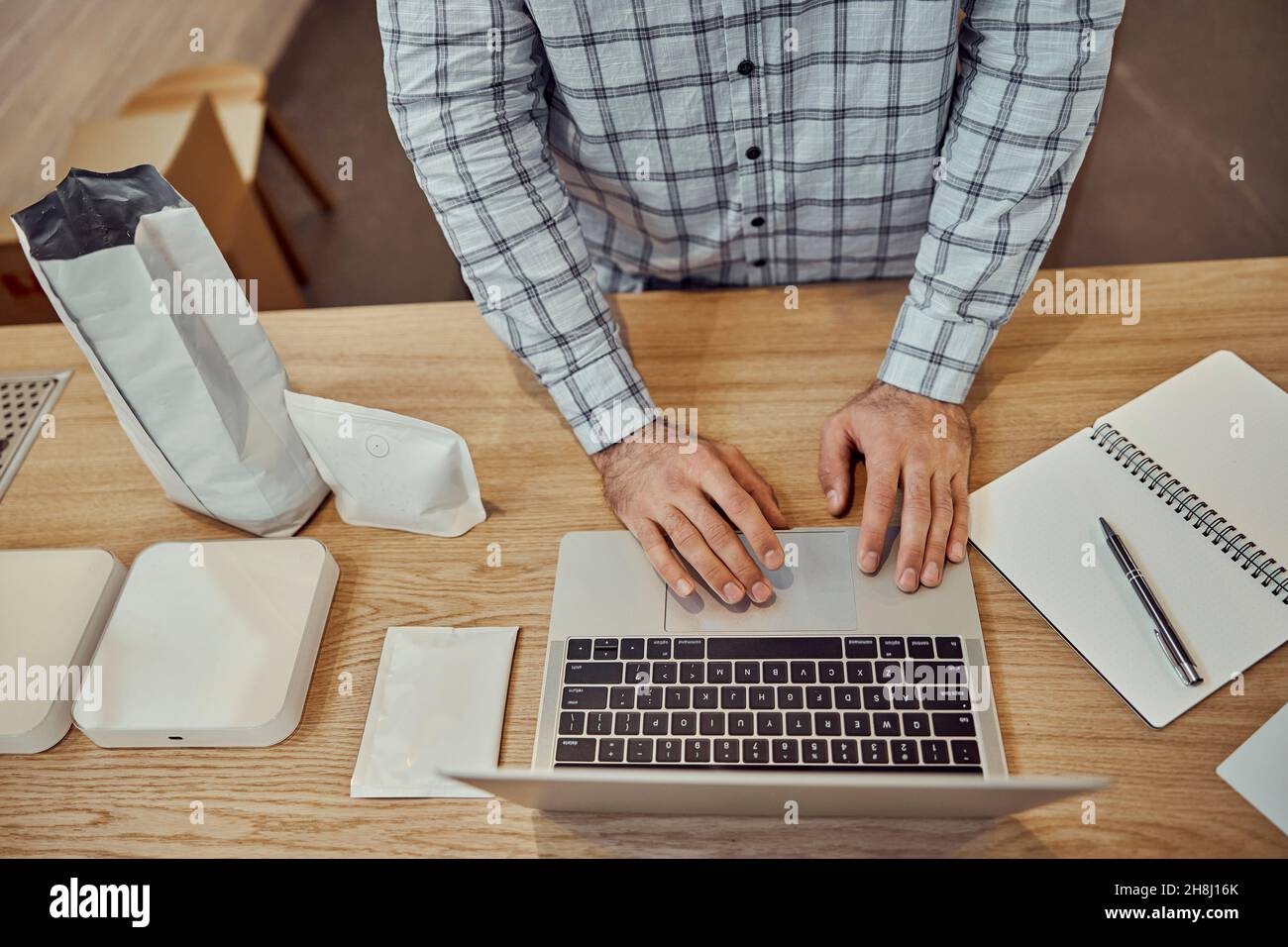 Male worker using modern laptop in cafe Stock Photo