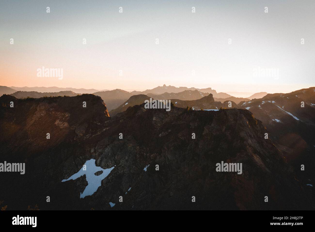 A beautiful sunset over mountains in North Cascades Stock Photo - Alamy
