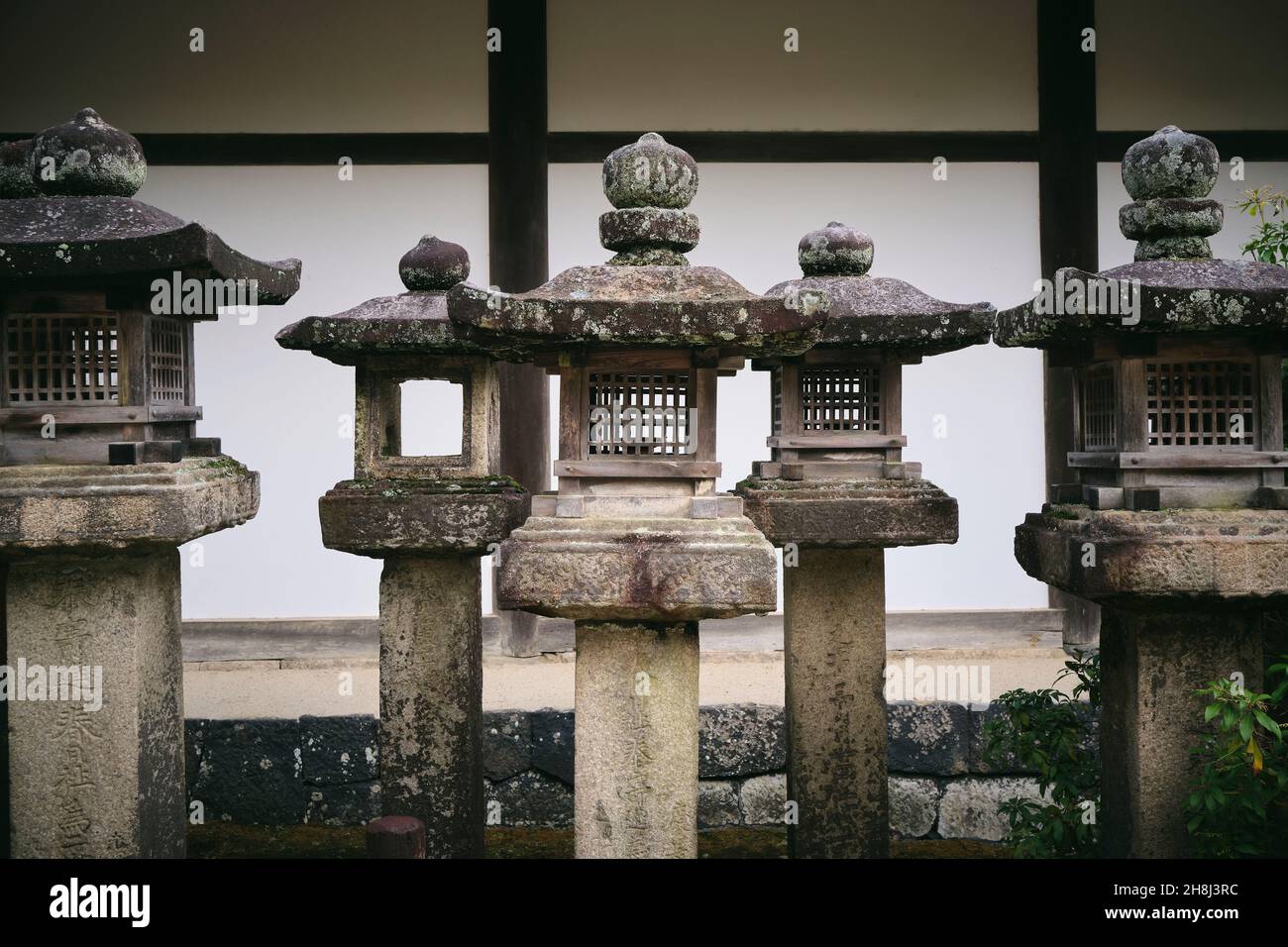 Traditional Stone Lanterns at a Temple in Nara, Japan Stock Photo