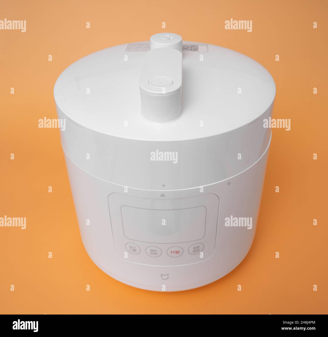 Germany, Berlin - 08.08.2021 : Xiaomi Mi Mijia Smart Pressure Cooker on yellow background Stock Photo