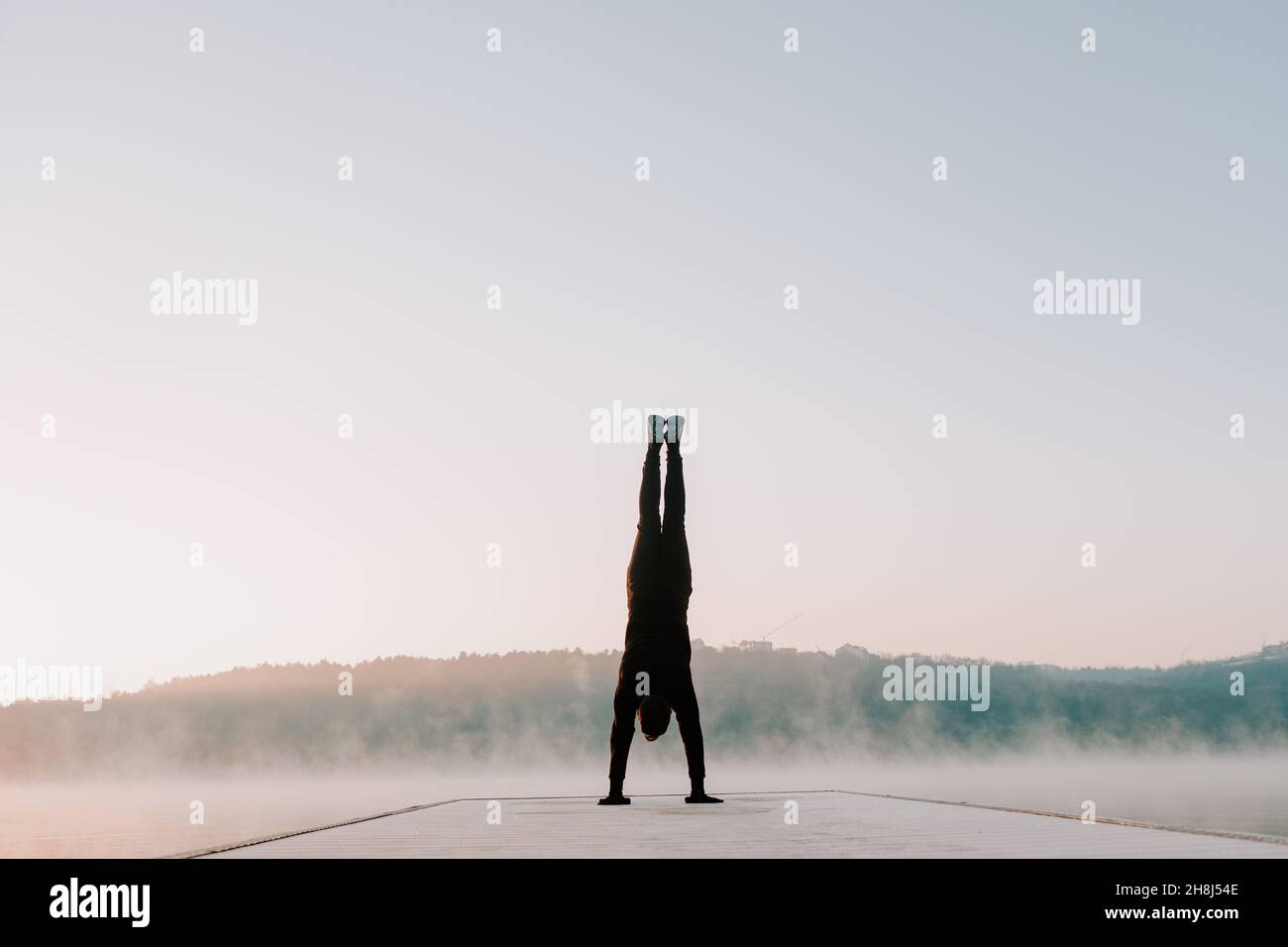 Man in the morning doing exercises. Stock Photo