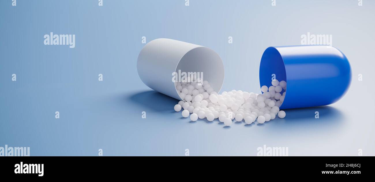 An open pill capsule spilling the active ingredient Stock Photo Alamy