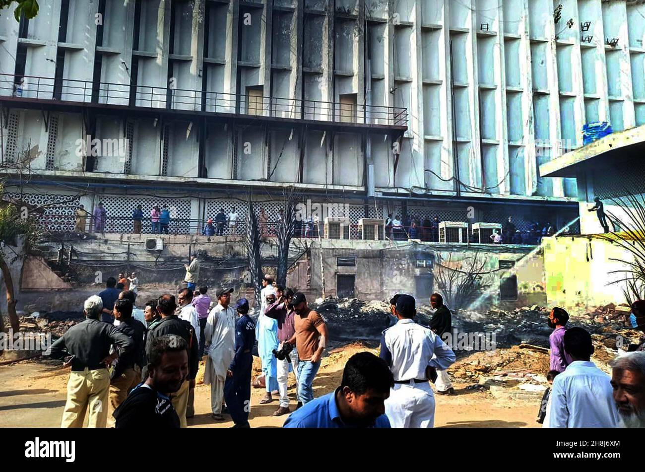 Hyderabad, Pakistan, November 30, 2021. View of venue after fire erupted out incident at PTCL Plaza building as fire brigade officials are busy in exhausting the fire located on I. I. Chundrigar road in Karachi on Tuesday, November 30, 2021. A fire which erupted at PTCL Plaza near I.I. Chundrigar Road, Karachi, on Tuesday morning has been extinguished. Karachi has witnessed several incidents of fire in November. Two major fires gutted several shop at the Cooperative Market and at the Zainab Market's Victoria building. Stock Photo