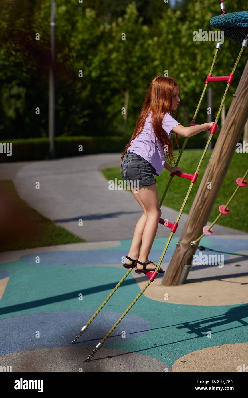 child girl having fun on playground in sunny day Stock Photo - Alamy